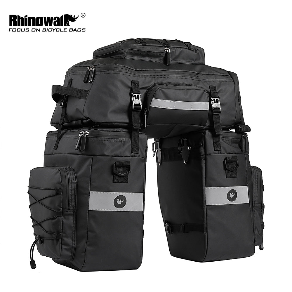 Bike Pannier Bag 3 in 1 Set 65L made by Rhinowalk. A 3 in 1 multifunctional bike rear pannier bag - 2 x one side shoulder bags and 1x backpack that can be used independently. Quick release system, easy to be fixed on rear seat trunk rack. Made of 1000D polyester material with waterproof PVC layer.